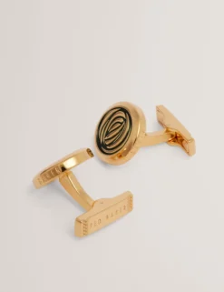 Goldene und grüne spiralförmige Manschettenknöpfe