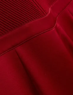 Jumpsuit mit Strickoberteil und geblümtem Hosenaufschlag