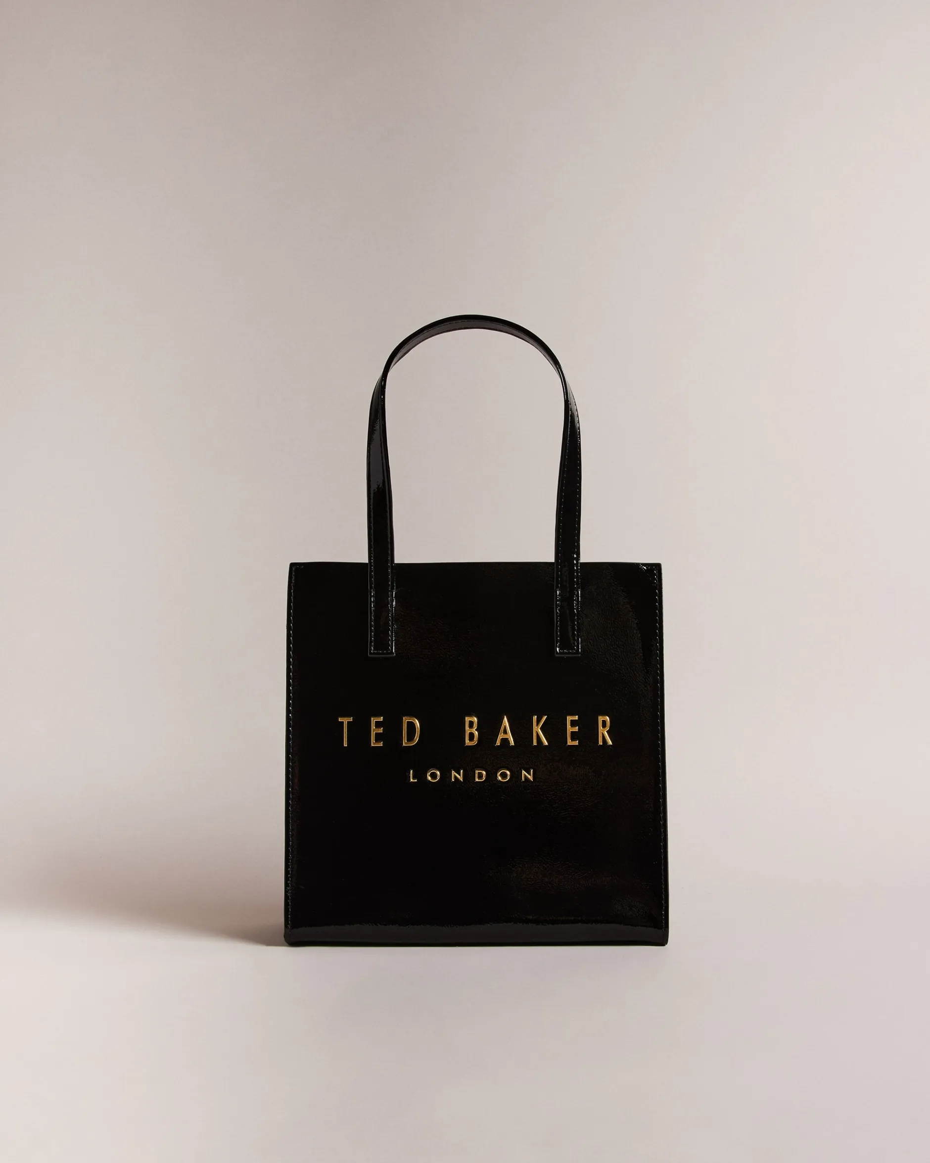 Kleine Tragetasche mit Crinkle-Textur und Icon-Motiv